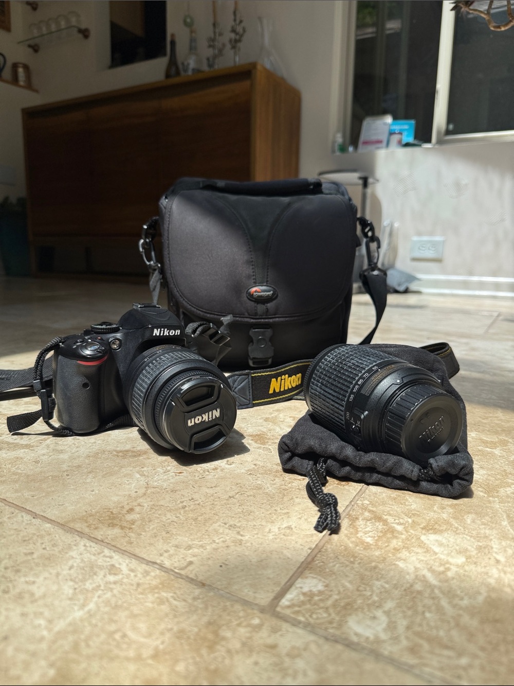 Nikon D5100 DSLR camera, 18-55mm lens, extra zoom 55-200mm, accessories, & bag